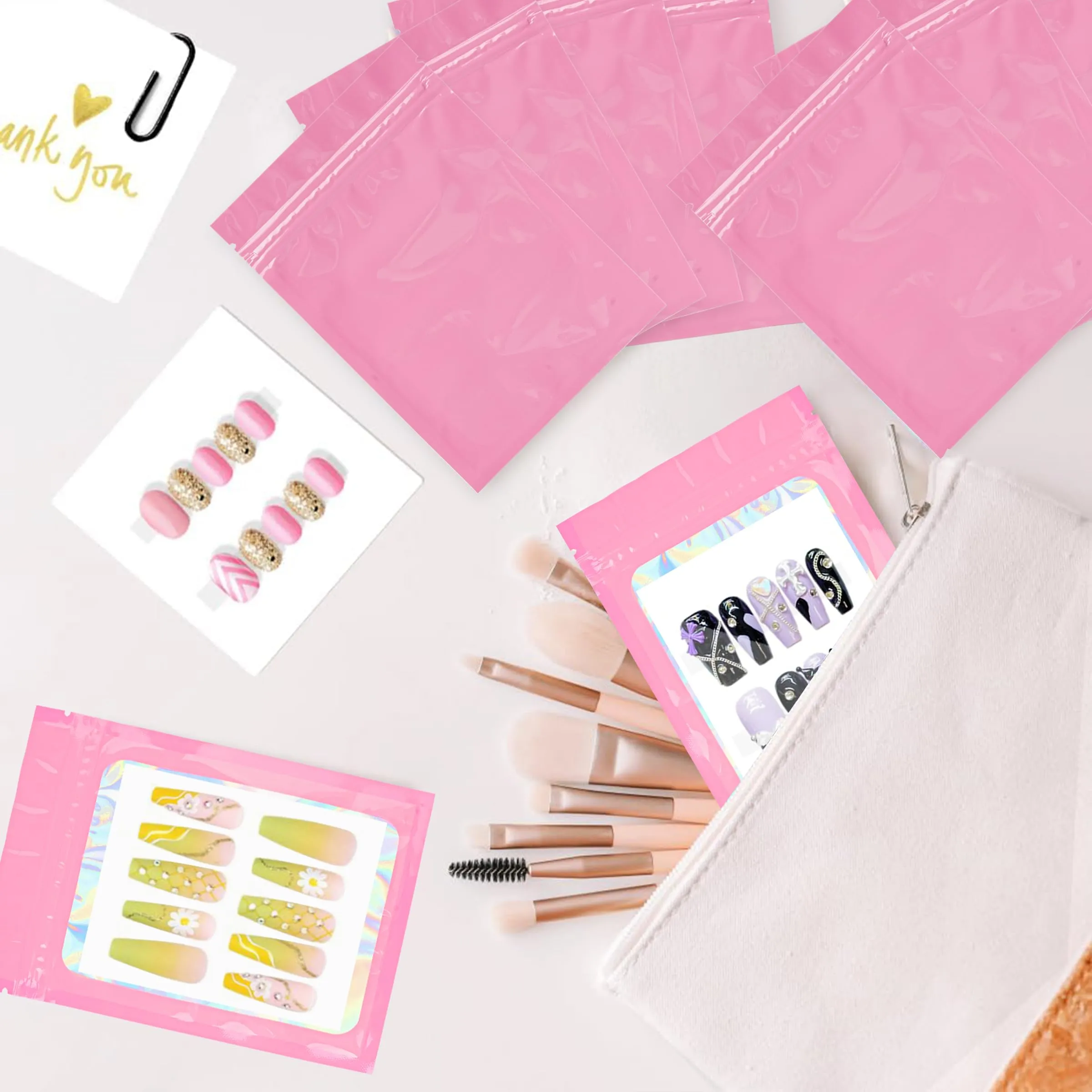 100PCS Empty Solid Pink Holographic Nail Storage Bag Press on Nail Packaging Bag and 100PCS Shiny white cardboard Nail Tips Packaging Bags with 1 Roll Transparent Tape